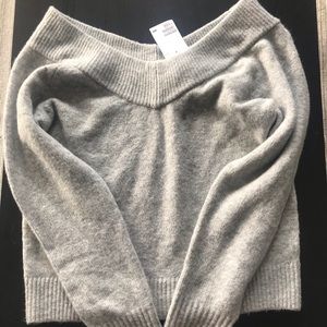 Grey sweather over the shoulder